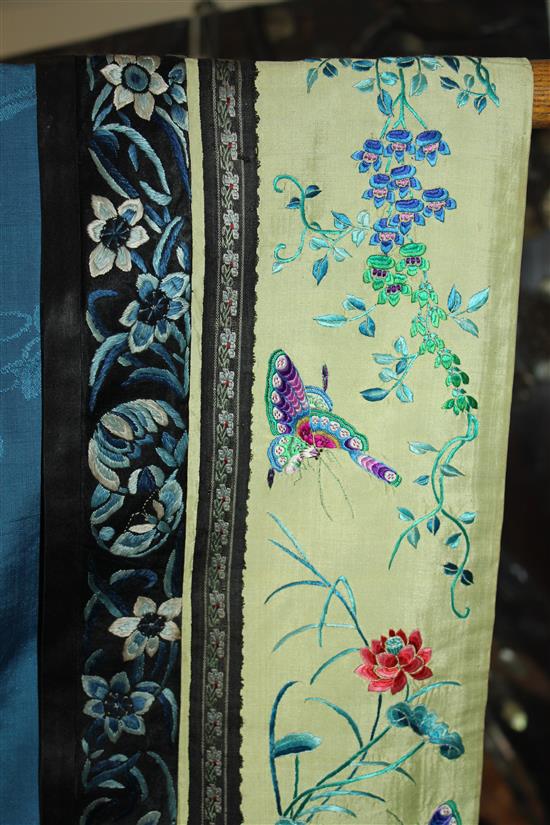 A Chinese blue silk, damask and embroidered ladys robe, late 19th / early 20th century,